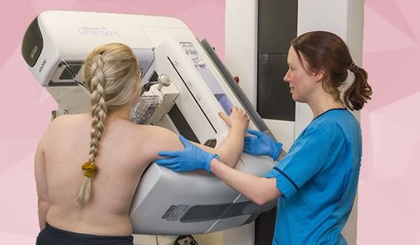 a woman getting a mammogram